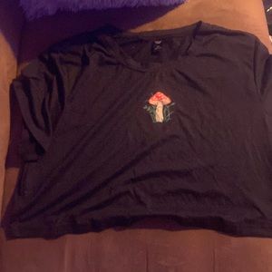 it’s a black shein crop top with a mushroom in the middle